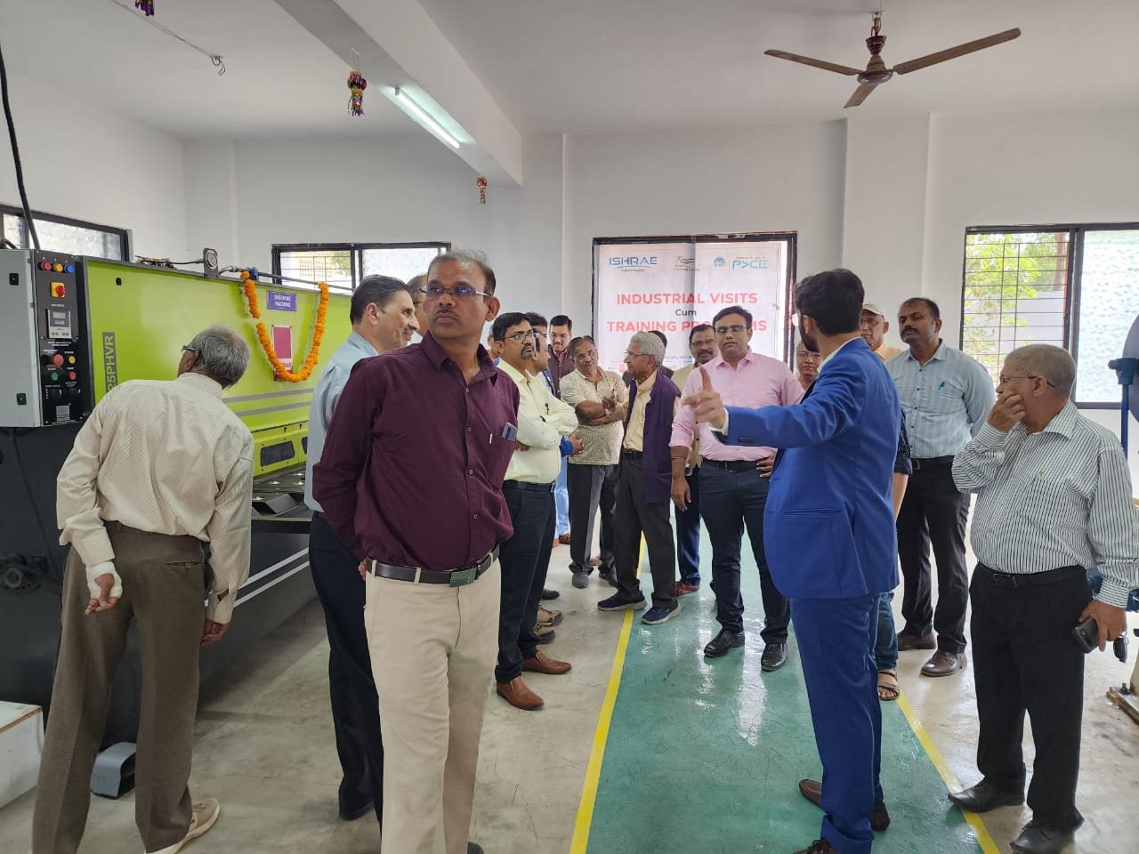 Factory Engineers Explaining Heat Exchanger Testing
